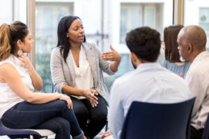 Diverse group benefiting from CBT in a therapy session